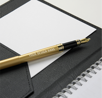 A pen and paper sitting on top of a notebook.